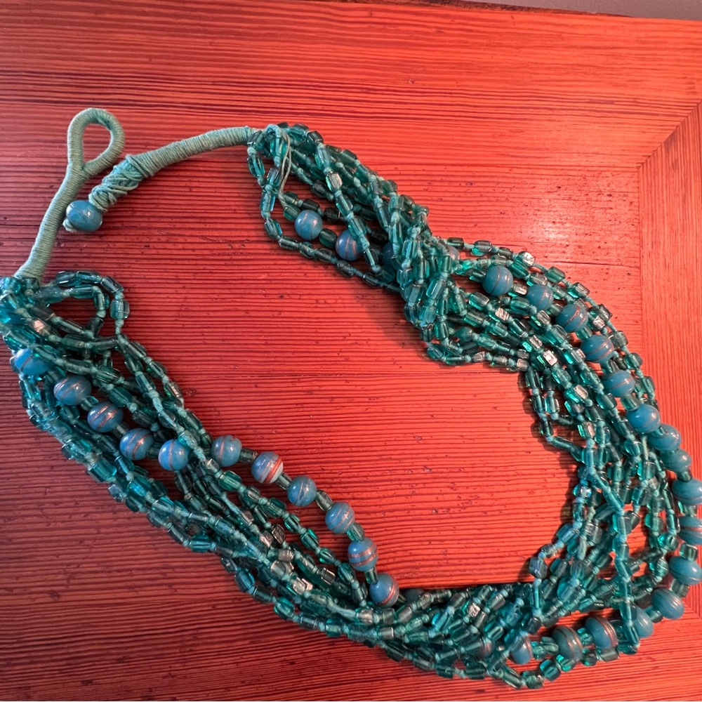Multi Strand Teal Bead Necklace. 24”.